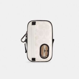 𝅺COACH North/South Hybrid Pouch In Colorblock Signature Canvas